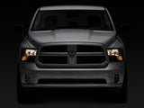 Phares OEM Raxiom 09-18 Dodge RAM 1500 Axial avec double ampoule - Boîtier chromé (lentille fumée)