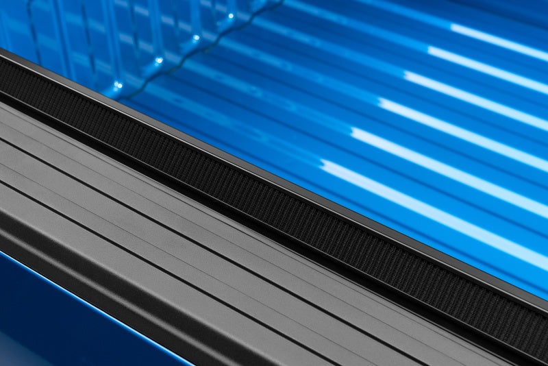 Couvre-caisse enroulable Lund 94-01 pour Dodge Ram 1500 (caisse de 8 pi) Genesis - Noir