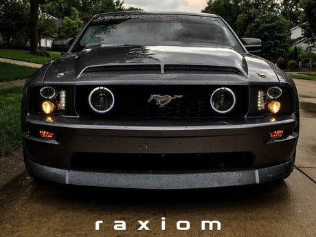 Phares de projecteur à LED Raxiom 05-09 Ford Mustang à l'exclusion de la GT500 - Boîtier noir (lentille transparente)