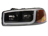 Raxiom 99-06 GMC Sierra 1500 Axial Series Headlights w/ LED Bar- Blk Housing (Clear Lens)