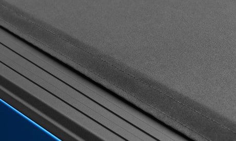 Lund 05-17 Nissan Frontier (caisse de 5 pieds sans chenille utilitaire) Genesis Elite Roll Up Tonneau Cover - Noir