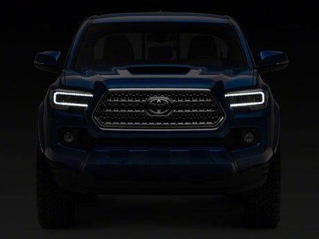 Raxiom 16-23 Toyota Tacoma avec phares halogènes DRL à LED d'usine - Boîtier noir (lentille transparente)